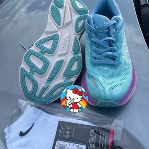 New Hoka sneakers/Never worn. Comes with a free pair of white ankle socks.